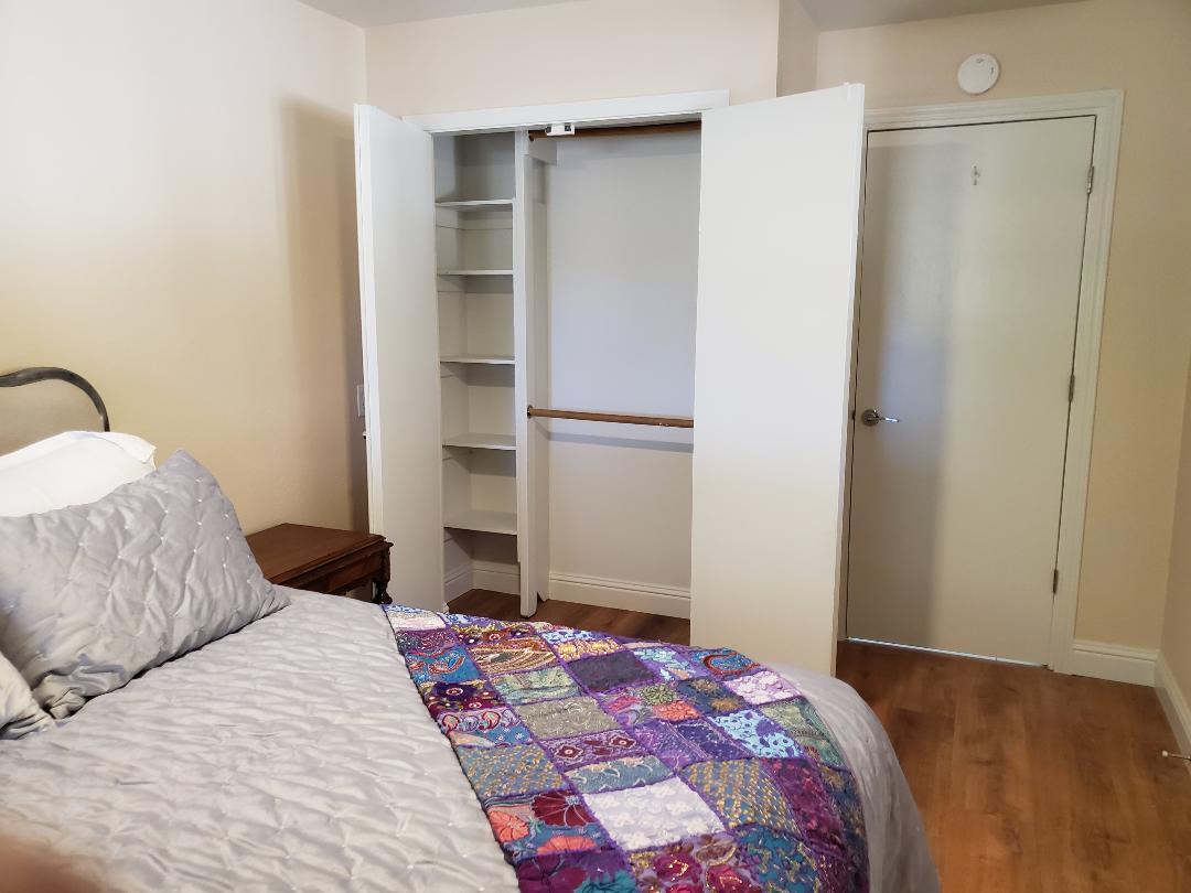 5521 Churn Crk Road Redding, CA 96002 - Photo 81 of 154 a bedroom with a bed and a cabinets