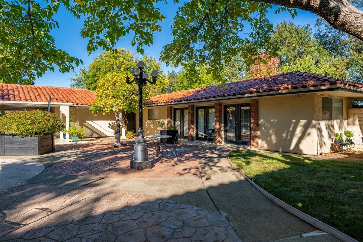 5521 Churn Crk Road Redding, CA 96002 - Photo 83 of 154 a view of a house with backyard garden and sitting area