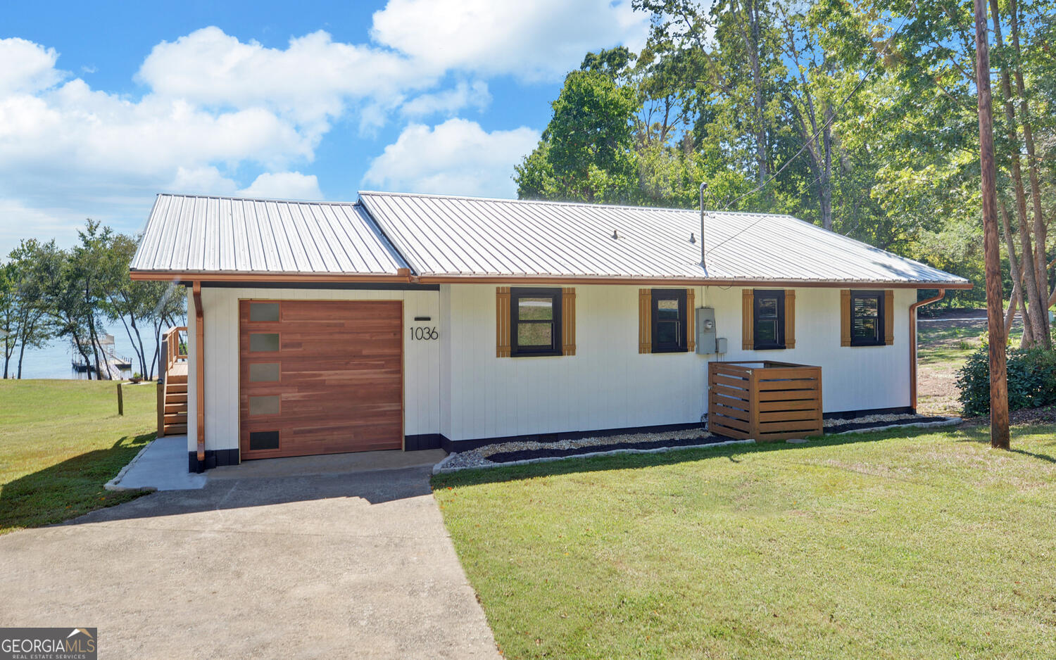 a front view of a house with a garden