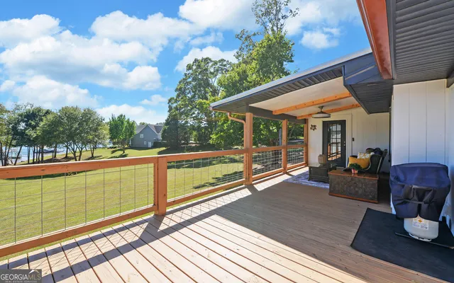 a view of a two chairs in the balcony