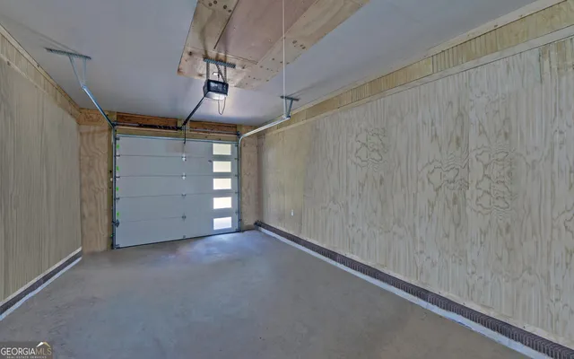 a room with a stove and a refrigerator