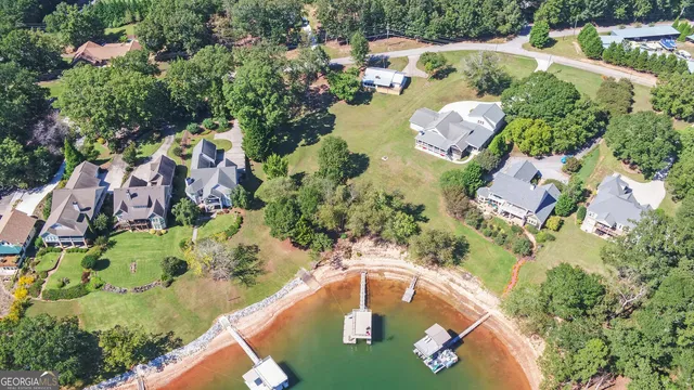 an aerial view of a house with yard swimming pool and outdoor seating