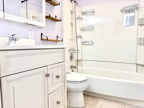 a bathroom with a sink a toilet and a bathtub