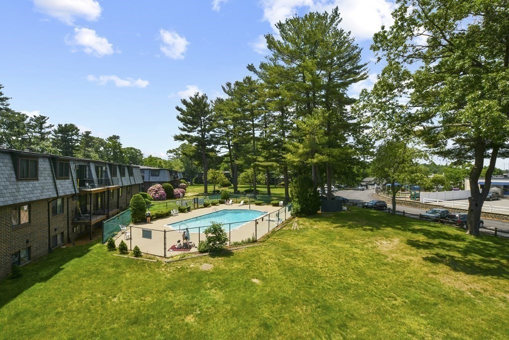 36 Main Street, Unit 26 North Reading, MA 01864 - Photo 17 of 19 a view of a house with swimming pool and sitting area