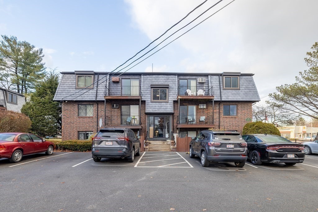 36 Main Street, Unit 26 North Reading, MA 01864 - Photo 18 of 19 a car parked in front of a house
