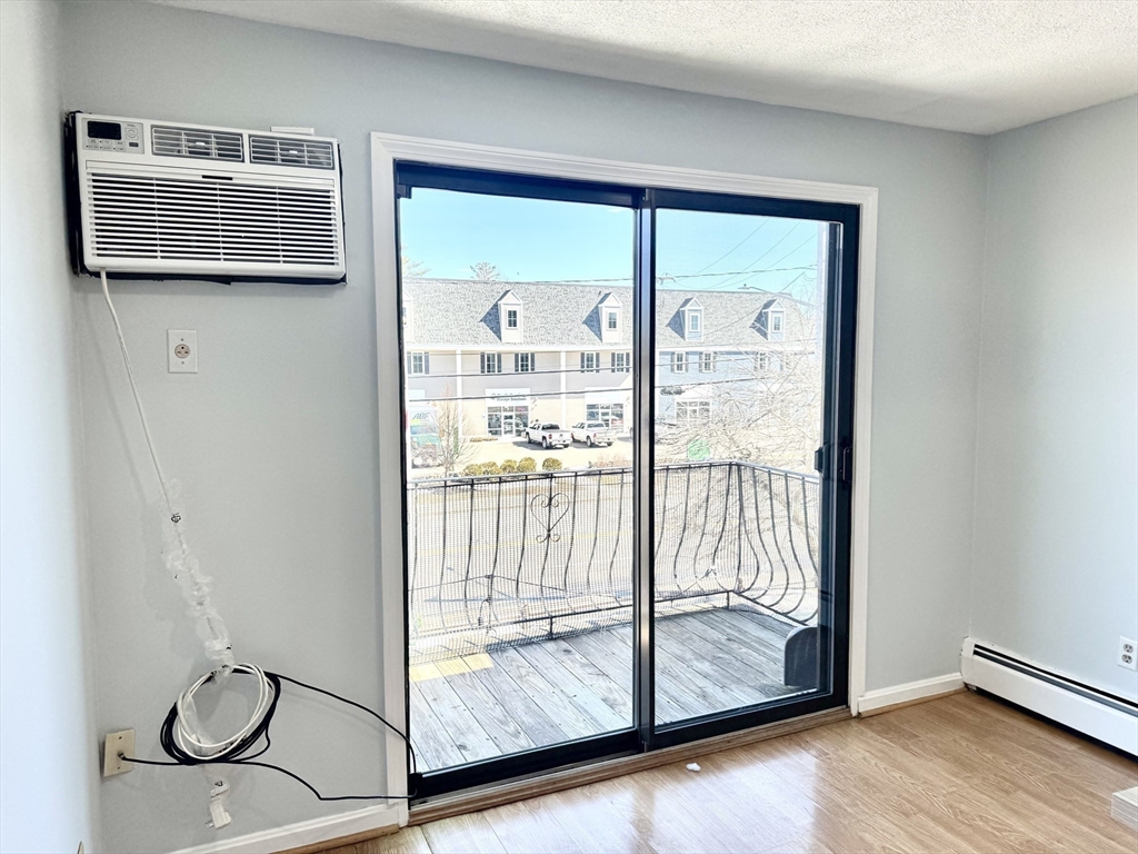 36 Main Street, Unit 26 North Reading, MA 01864 - Photo 8 of 19 a view of entryway with wooden floor and door