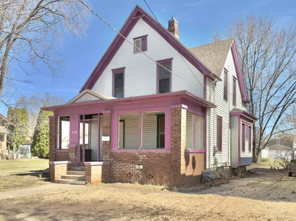 a view of a white house with a large windows