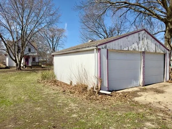 a view of a house with a snow in the yard