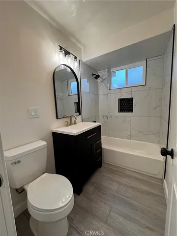 a bathroom with a sink toilet and bathtub