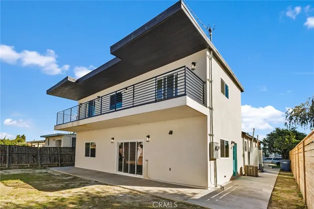 a view of house with swimming pool and porch