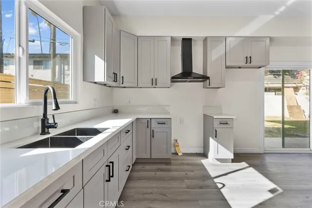 a kitchen with a sink cabinets and window