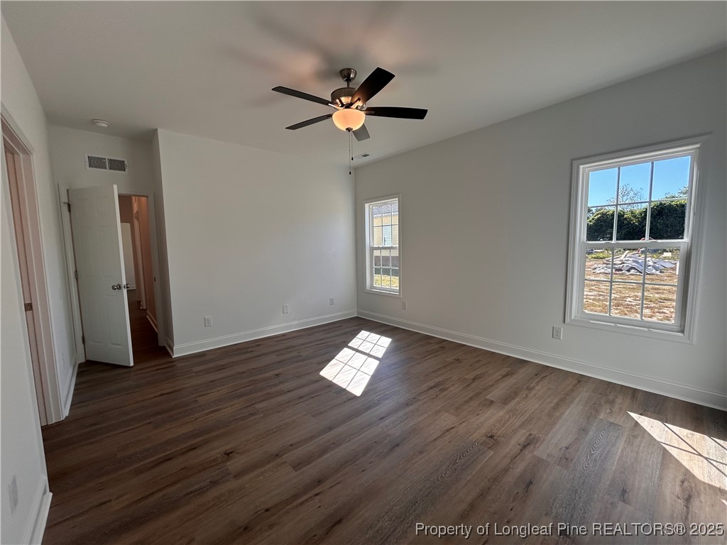 403 Morehead Street Spring Lake, NC 28390 - Photo 12 of 15 a view of an empty room with wooden floor and a window