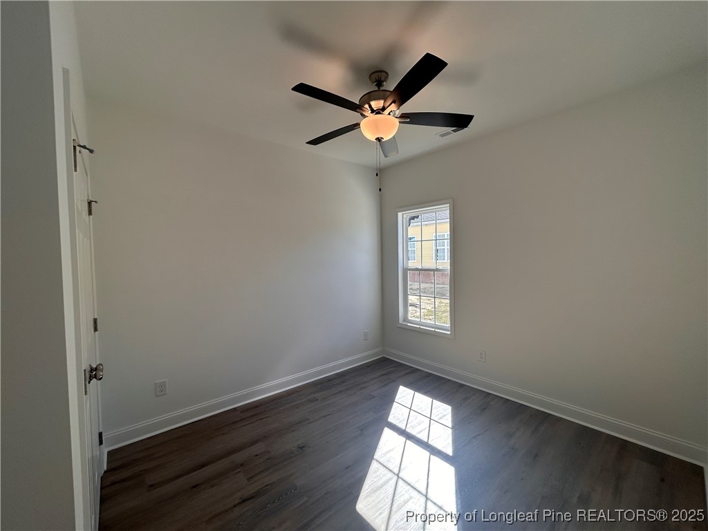403 Morehead Street Spring Lake, NC 28390 - Photo 15 of 15 a view of wooden floor and a window in a room