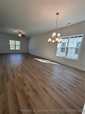 a view of a livingroom with wooden floor
