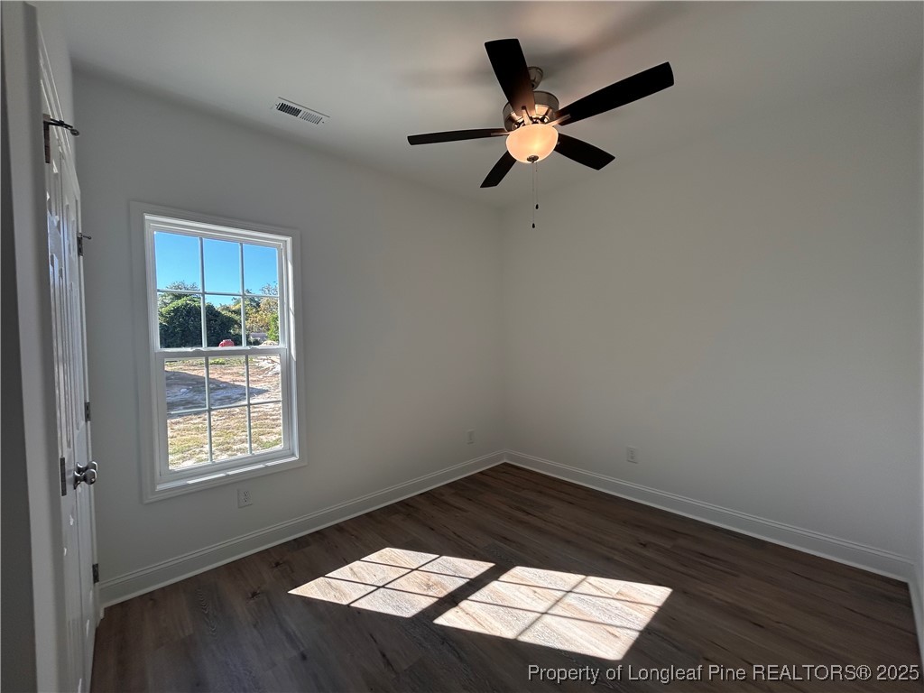 403 Morehead Street Spring Lake, NC 28390 - Photo 10 of 15 a view of a ceiling fan and wooden floor in a room