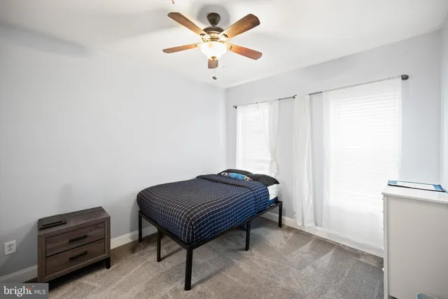 a room with a bed and a chandelier