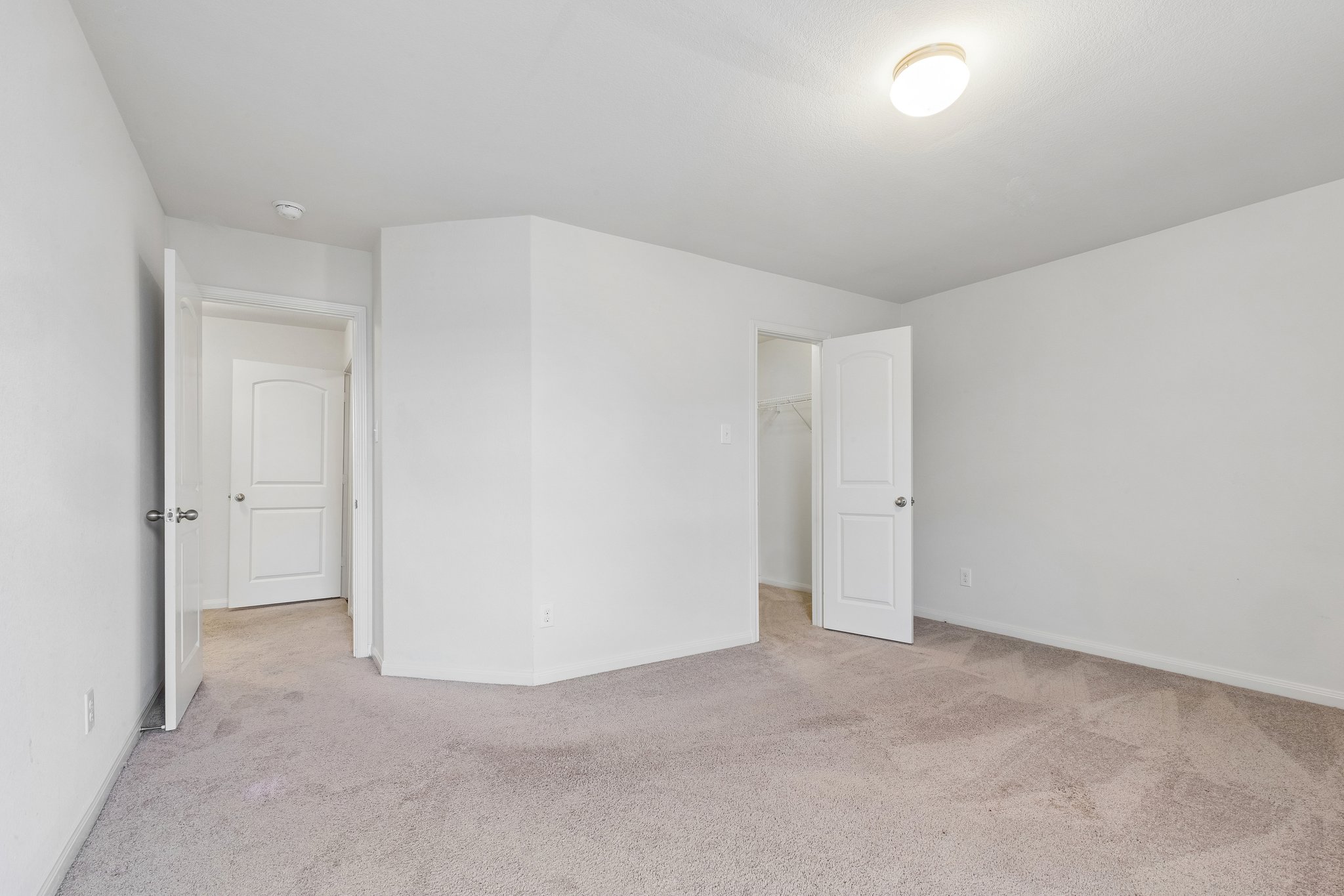 704 Cleary Lane Jarrell, TX 76537 - Photo 15 of 25 Spacious room featuring neutral carpeting, a flush-mount ceiling light, and white walls