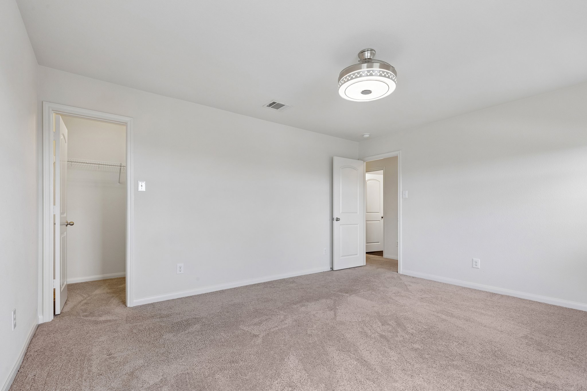 704 Cleary Lane Jarrell, TX 76537 - Photo 18 of 25 Spacious room featuring neutral carpet flooring and white walls