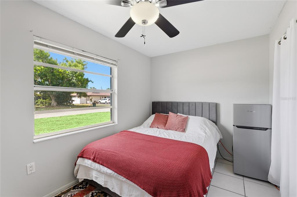 3670 Sunset Beach Drive Venice, FL 34293 - Photo 21 of 51 a bedroom with a bed and a window