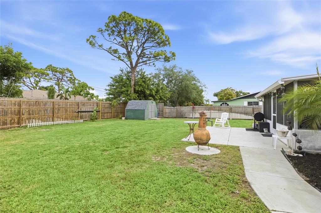 3670 Sunset Beach Drive Venice, FL 34293 - Photo 28 of 51 a front view of a house with garden