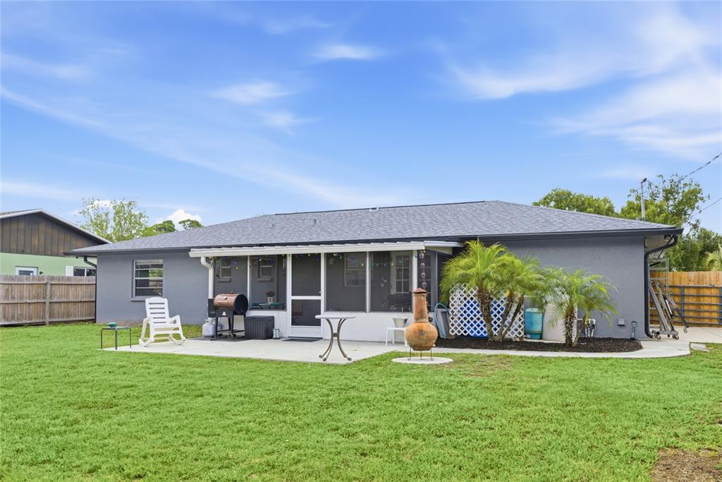 3670 Sunset Beach Drive Venice, FL 34293 - Photo 29 of 51 a front view of house with a garden and patio