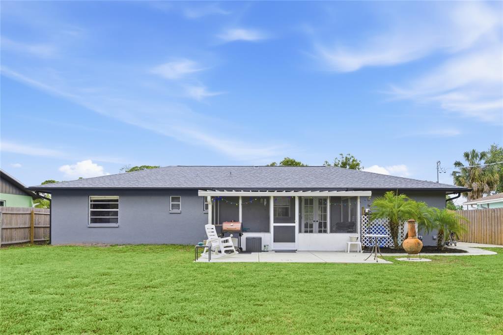 3670 Sunset Beach Drive Venice, FL 34293 - Photo 30 of 51 a front view of a house with a garden and patio