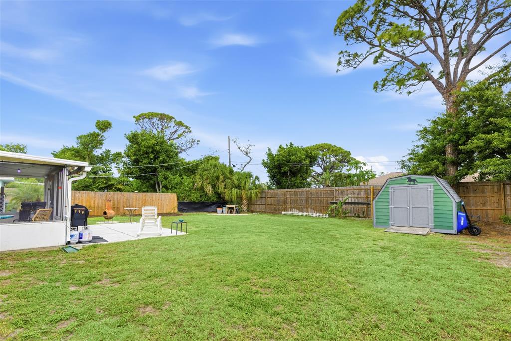 3670 Sunset Beach Drive Venice, FL 34293 - Photo 31 of 51 a view of a house with a backyard and a tree
