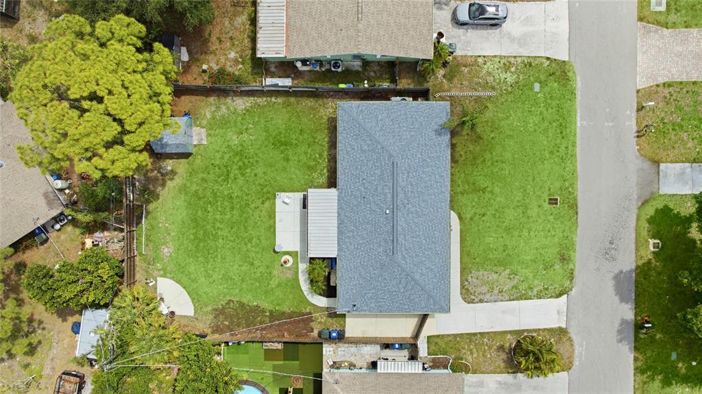 3670 Sunset Beach Drive Venice, FL 34293 - Photo 37 of 51 an aerial view of a house with a yard lake and trees all around
