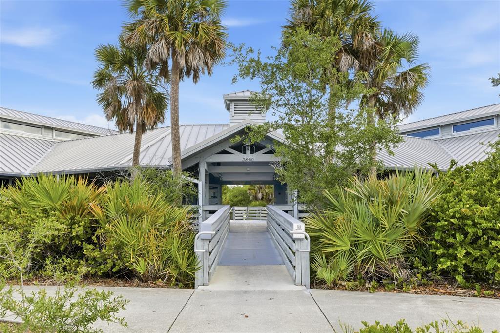 3670 Sunset Beach Drive Venice, FL 34293 - Photo 40 of 51 a front view of a house with garden