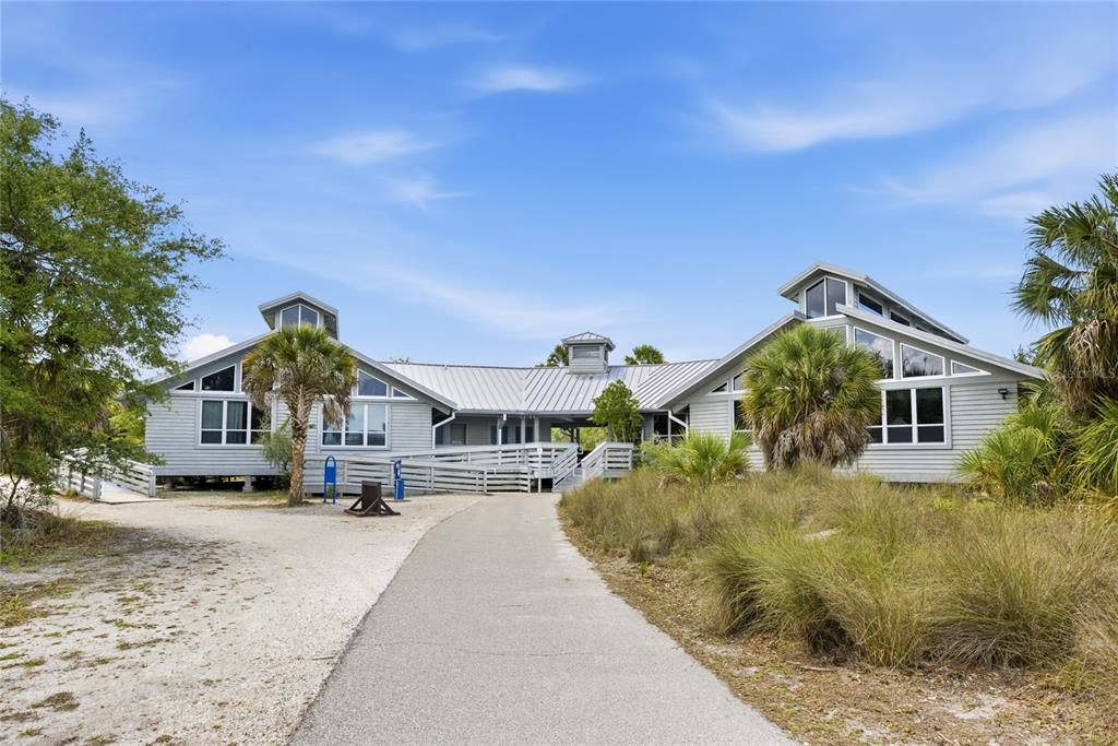 3670 Sunset Beach Drive Venice, FL 34293 - Photo 41 of 51 a front view of a house with a yard