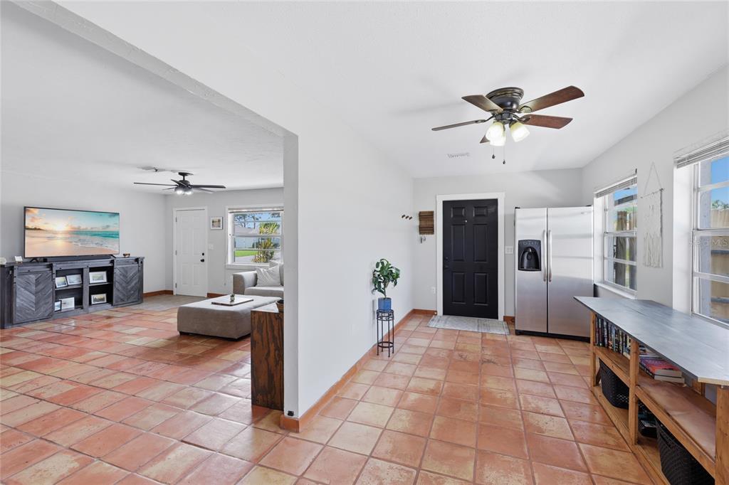 3670 Sunset Beach Drive Venice, FL 34293 - Photo 5 of 51 a view of a livingroom with furniture and a ceiling fan