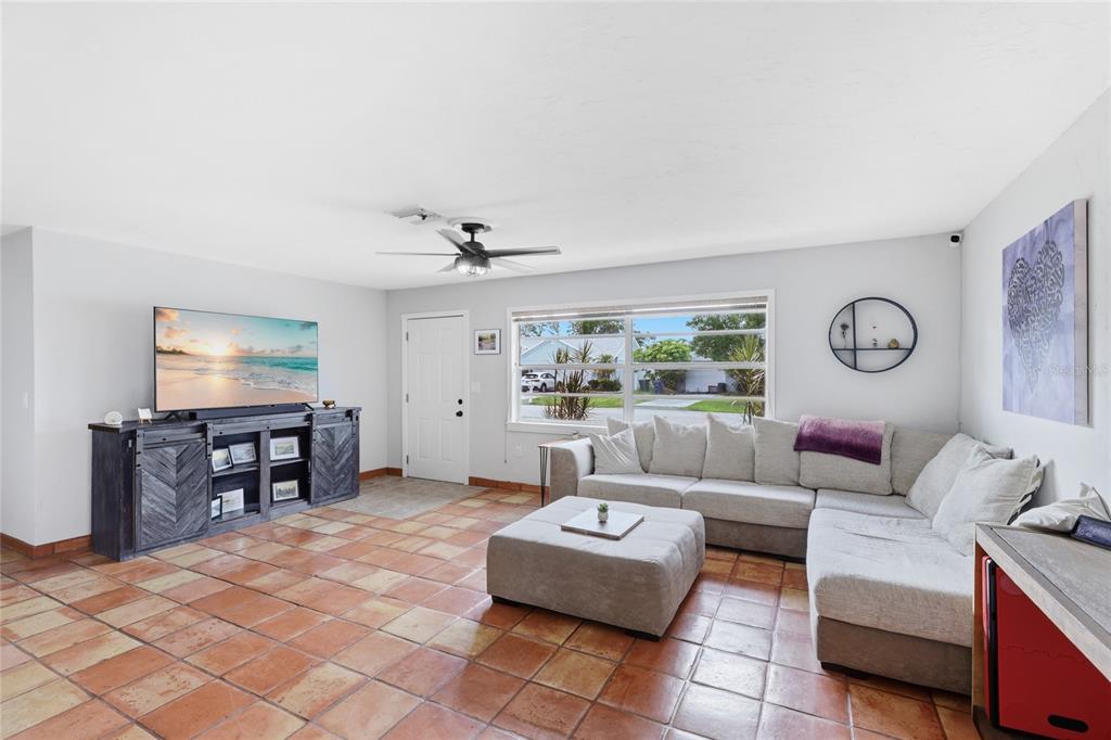 3670 Sunset Beach Drive Venice, FL 34293 - Photo 7 of 51 a living room with furniture and a flat screen tv