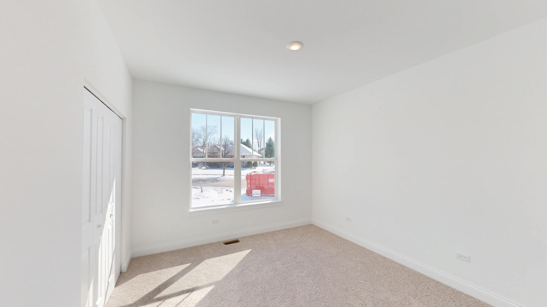 122 West Cache Isle Circle Channahon, IL 60410 - Photo 27 of 47 a view of an empty room with a window