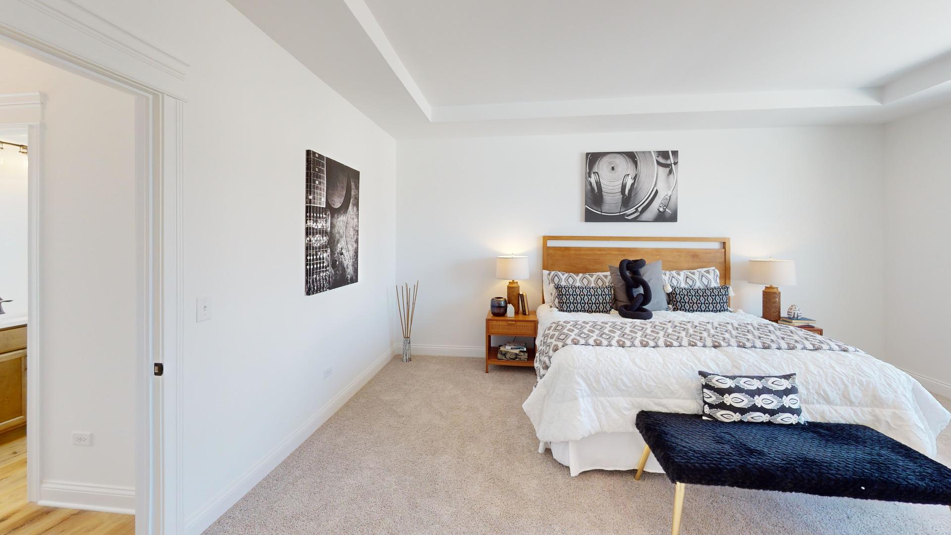 122 West Cache Isle Circle Channahon, IL 60410 - Photo 38 of 47 a bedroom with a bed and a couch