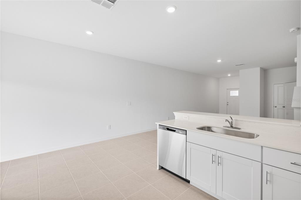 36148 Risa Michele Street Zephyrhills, FL 33541 - Photo 14 of 34 a bathroom with a sink and vanity