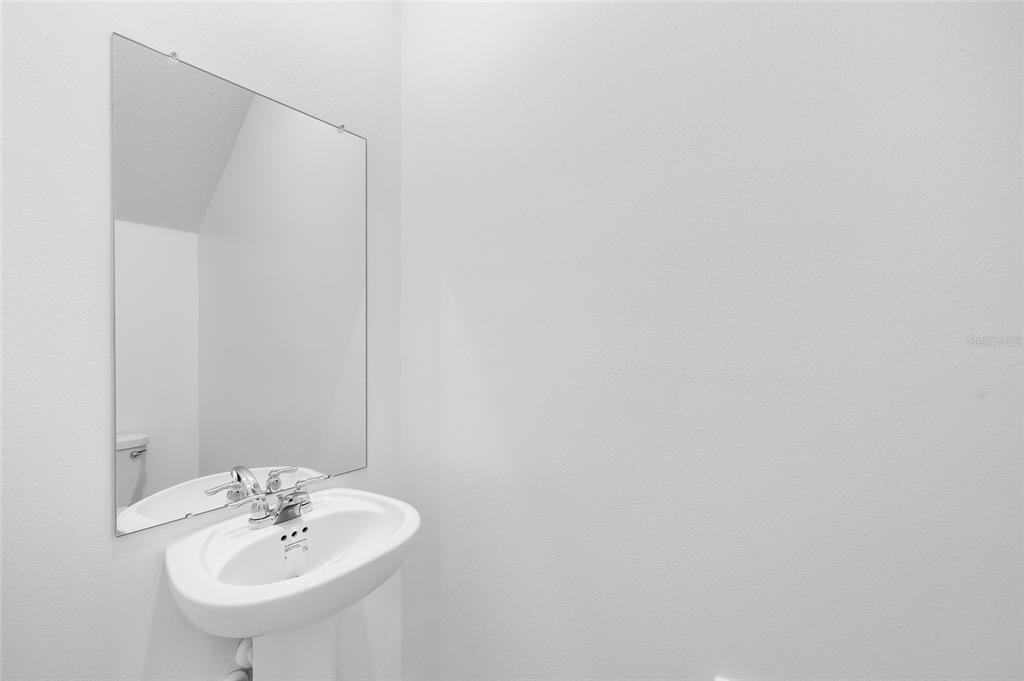 36148 Risa Michele Street Zephyrhills, FL 33541 - Photo 15 of 34 a bathroom with a sink and a mirror