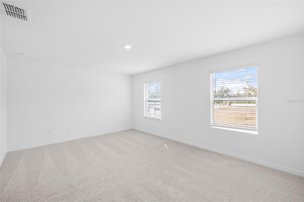 36148 Risa Michele Street Zephyrhills, FL 33541 - Photo 23 of 34 an empty room with a window