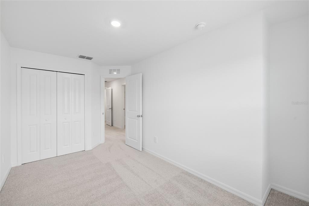 36148 Risa Michele Street Zephyrhills, FL 33541 - Photo 27 of 34 a view of an empty room