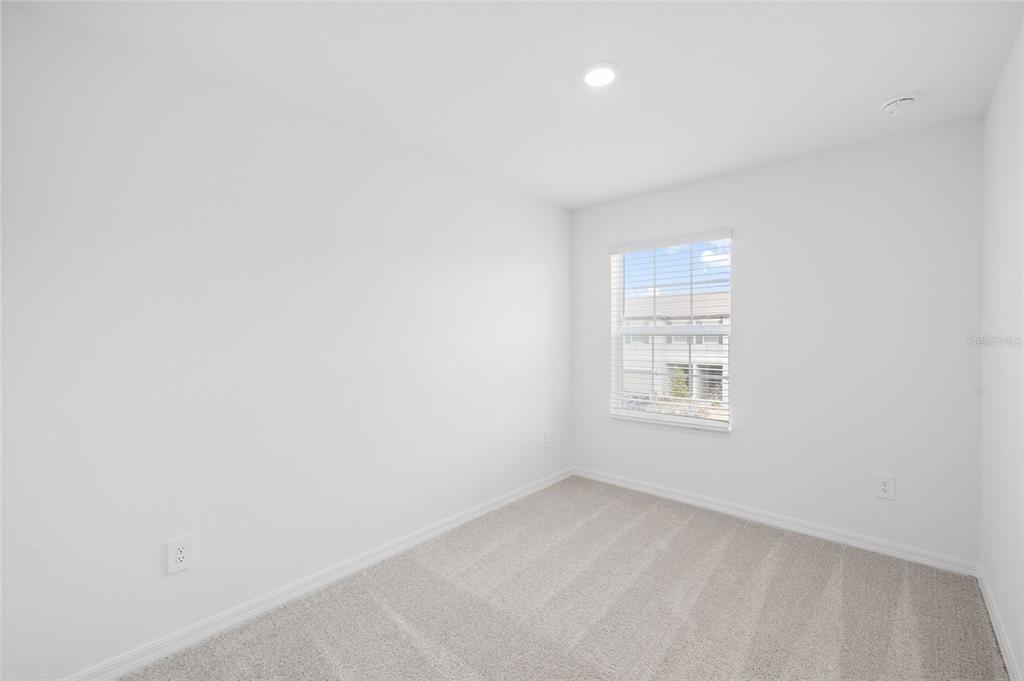 36148 Risa Michele Street Zephyrhills, FL 33541 - Photo 29 of 34 an empty room with a window