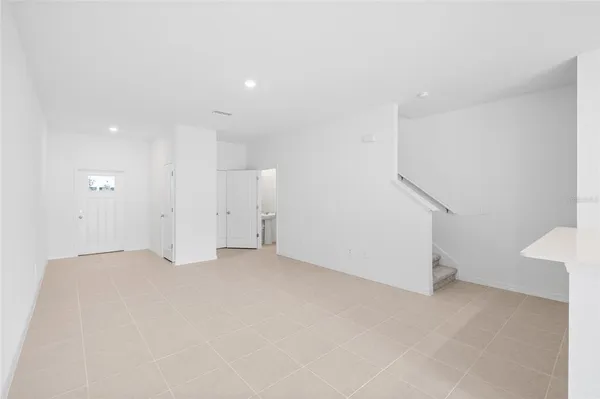 a kitchen with stainless steel appliances a refrigerator sink and microwave