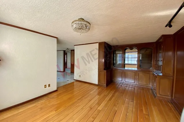 a view of empty room with a fireplace