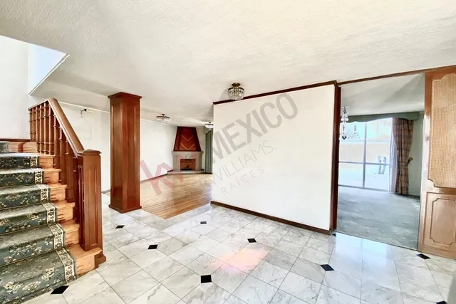 a view of a hallway with staircase