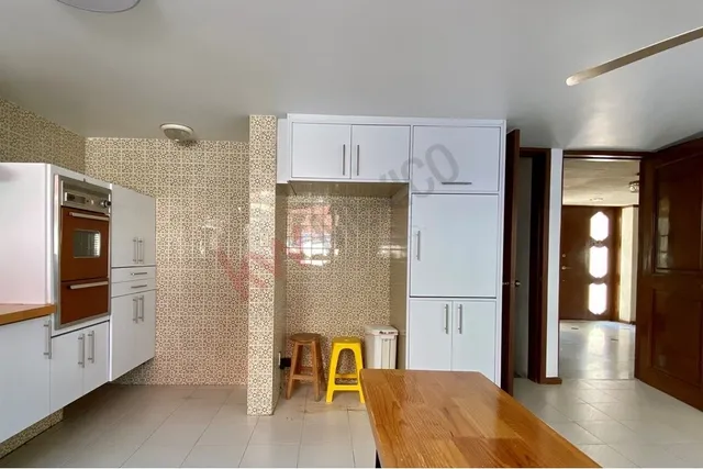 a view of kitchen with furniture and wooden floor