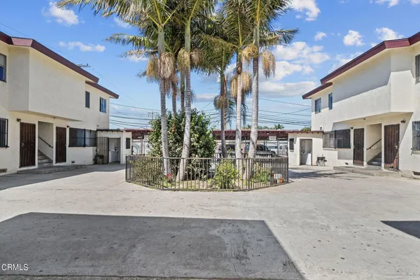 a view of a street with a building in the background