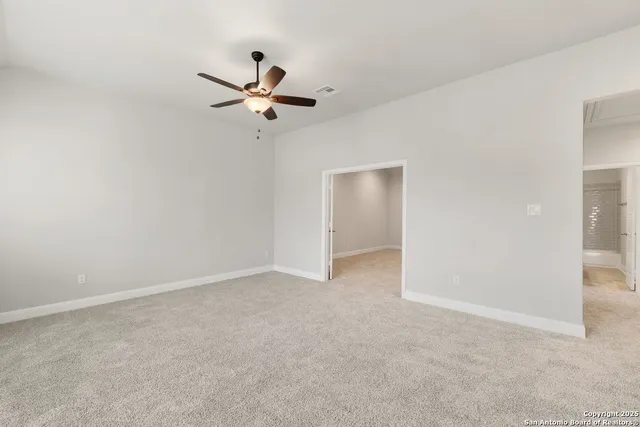 a view of a big room with carpet