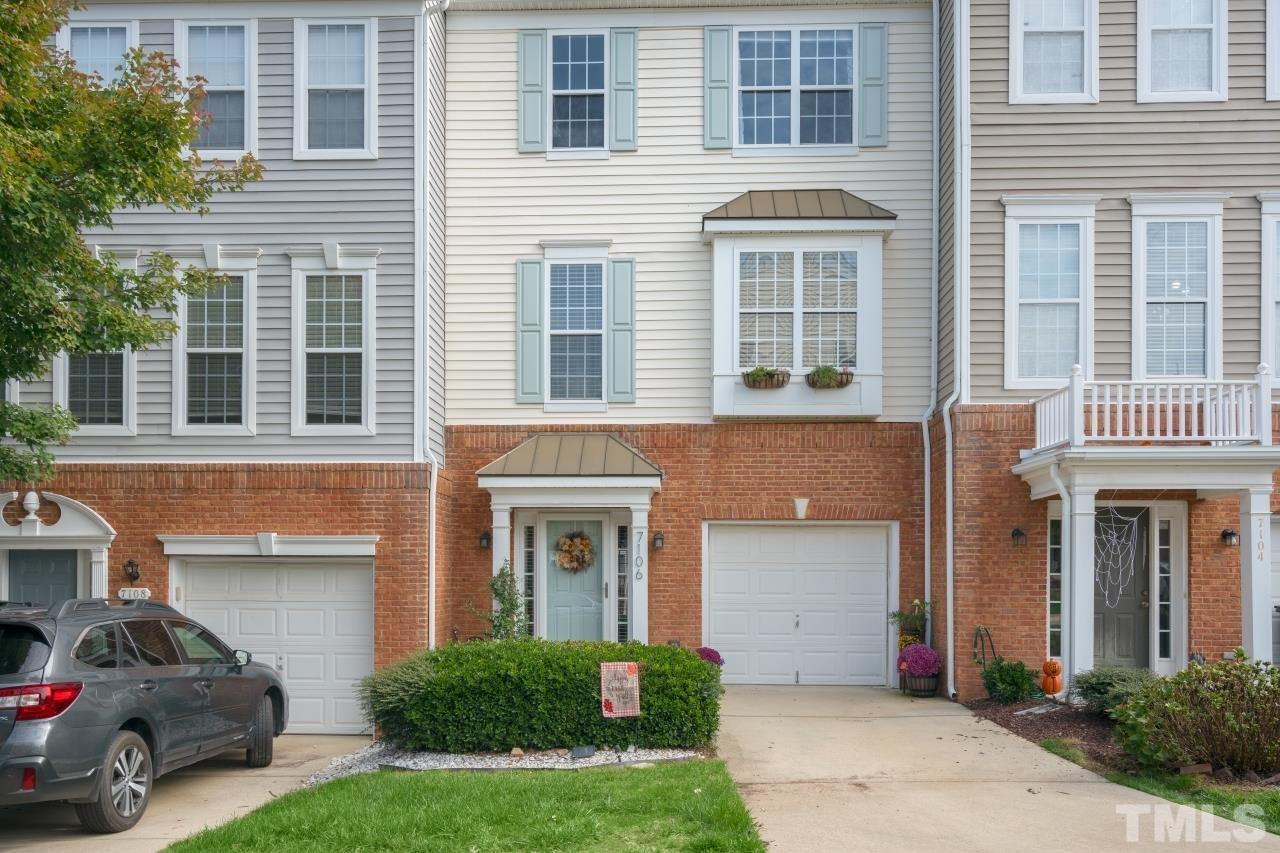 7106 Proctor Hill Drive Raleigh, NC 27613 - Photo 2 of 29 a front view of a house with a garden and garage