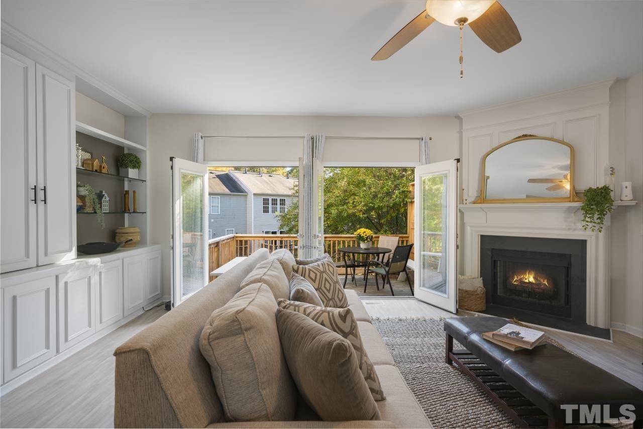 7106 Proctor Hill Drive Raleigh, NC 27613 - Photo 11 of 29 a living room with furniture and a fireplace