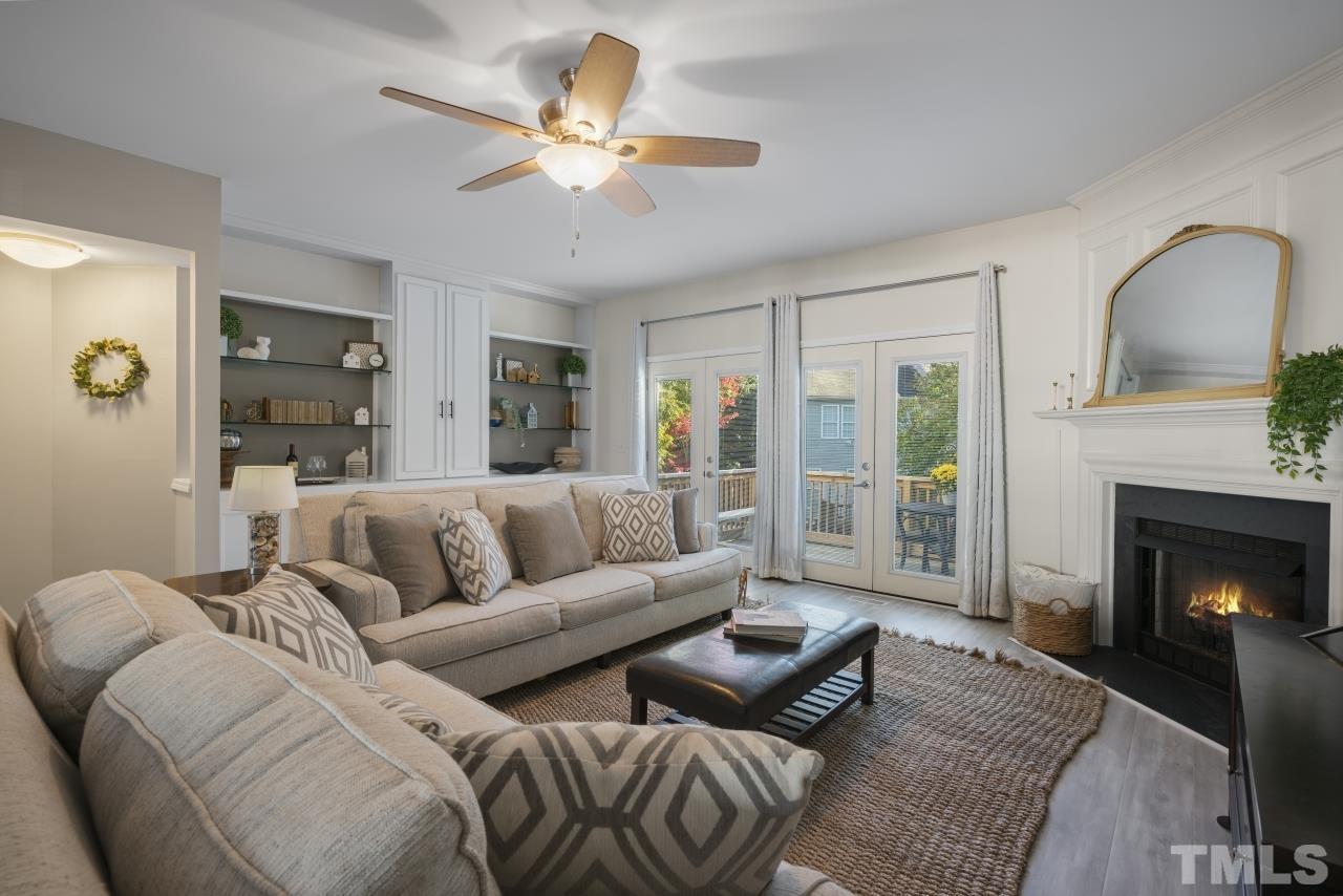 7106 Proctor Hill Drive Raleigh, NC 27613 - Photo 12 of 29 a living room with furniture and a fireplace