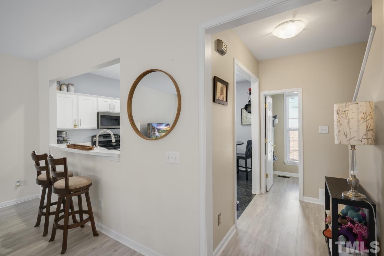 7106 Proctor Hill Drive Raleigh, NC 27613 - Photo 15 of 29 a view of a dining area with furniture and wooden floor