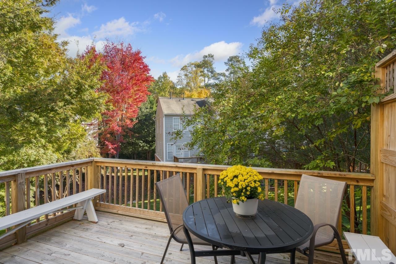 7106 Proctor Hill Drive Raleigh, NC 27613 - Photo 17 of 29 a view of a chair and table on the deck
